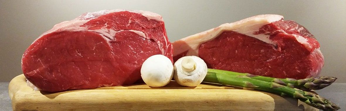 Beef steaks and vegetables