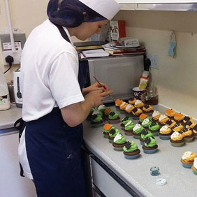 Cake decorating at the bakery of Lewis’s Farm Shop